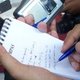 hand writing on notepad